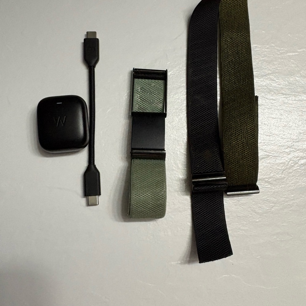 Whoop 4.0 with three band colors, fitness tracker